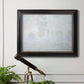 Impressionist atmospheric landscape in morning haze by Claude Monet in an ornate black frame with gilded inner detail displayed in a light-toned interior setting.
