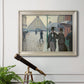Impressionist urban street scene in the rain by Gustave Caillebotte in an ornate champagne frame displayed in a light-toned interior setting.