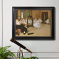 Impressionist dance class interior scene by Edgar Degas in an ornate black frame with gilded inner detail displayed in a light-toned interior setting.