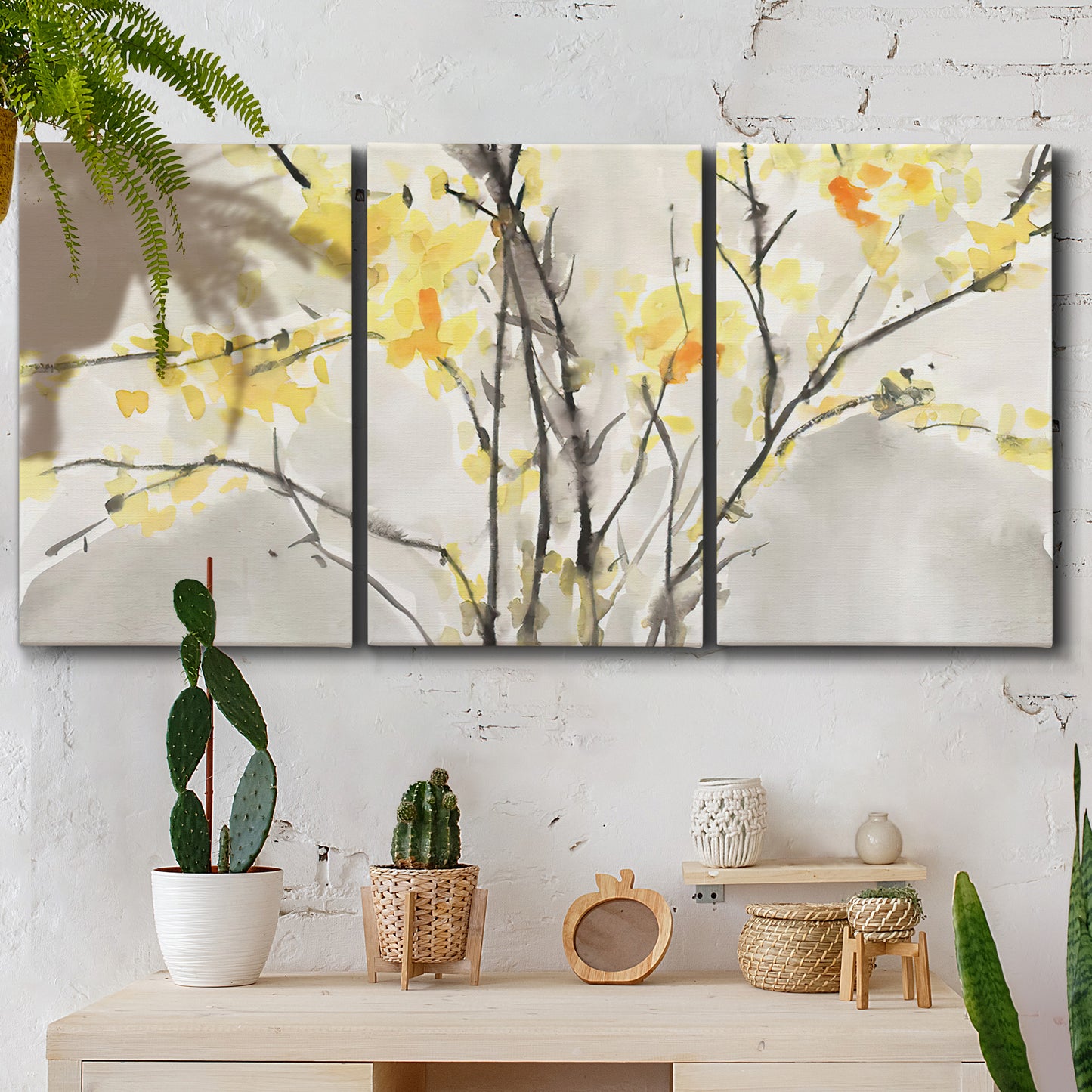 Three-panel canvas wall art featuring soft floral abstract harmony, displayed in a boho-chic entryway above a console table.