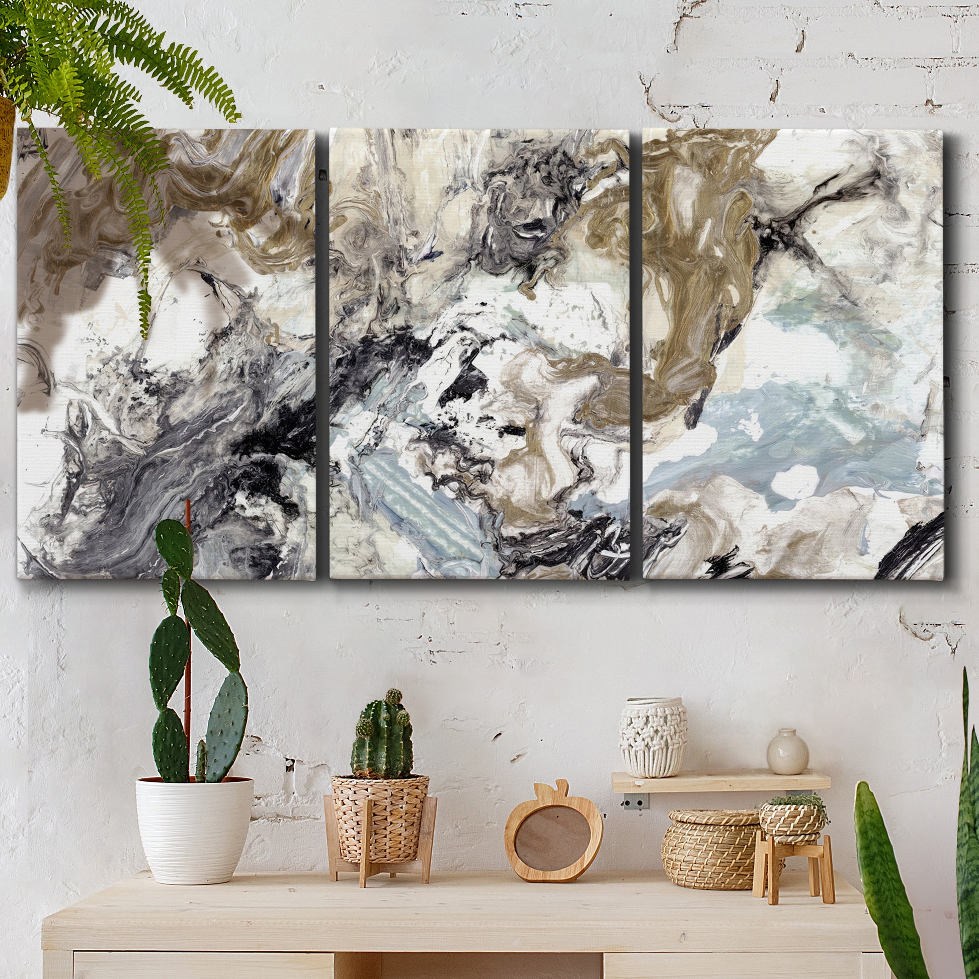 Three-panel canvas wall art featuring marbled modern abstract textures, displayed in a boho-chic entryway above a console table.
