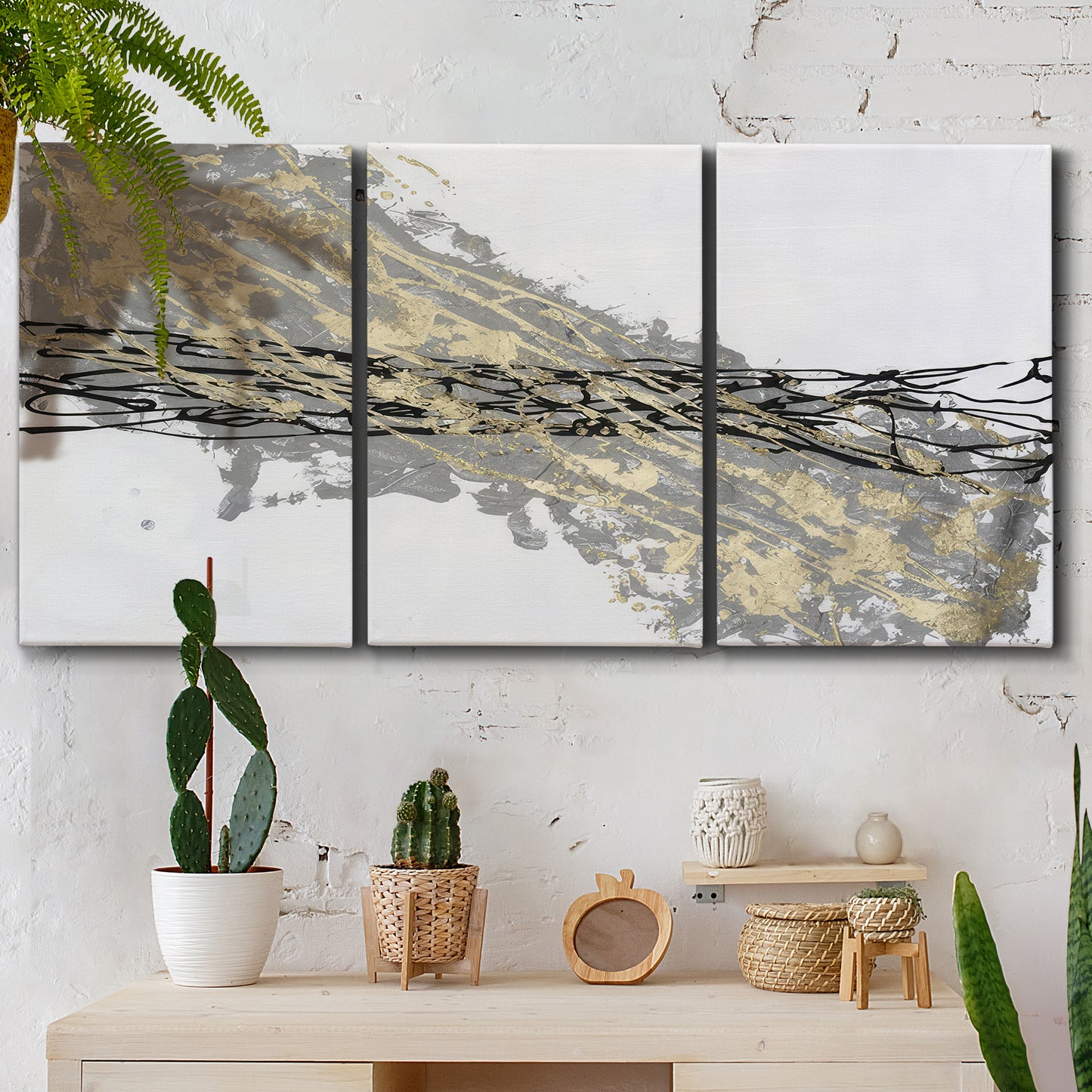 Three-panel canvas wall art featuring light modern abstract wind patterns, displayed in a boho-chic entryway above a console table.