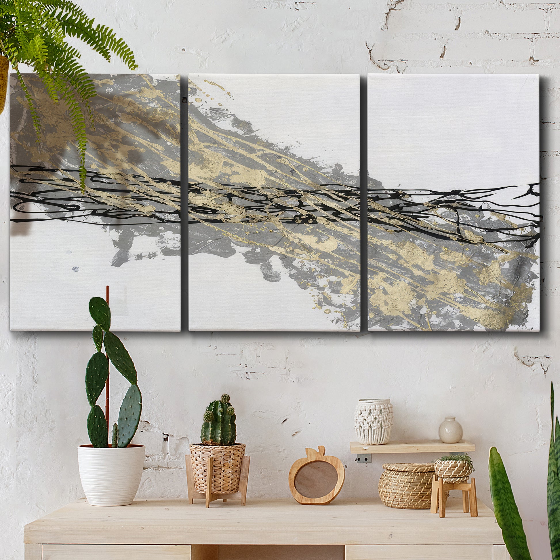 Three-panel canvas wall art featuring light modern abstract wind patterns, displayed in a boho-chic entryway above a console table.