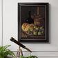 Realist still life with figs and bread by Luis Meléndez in an ornate black frame with gilded inner detail displayed in a light-toned interior setting.