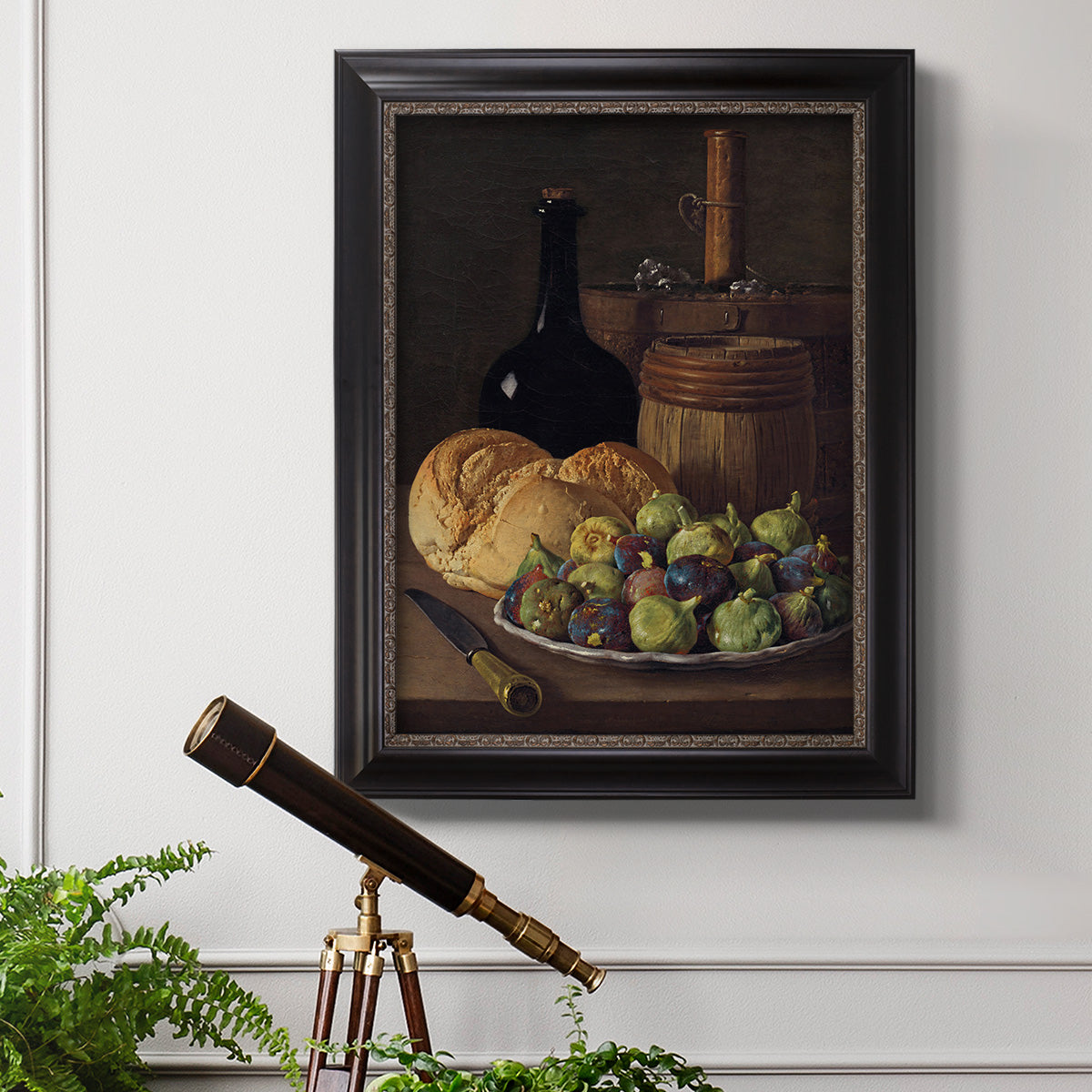 Realist still life with figs and bread by Luis Meléndez in an ornate black frame with gilded inner detail displayed in a light-toned interior setting.