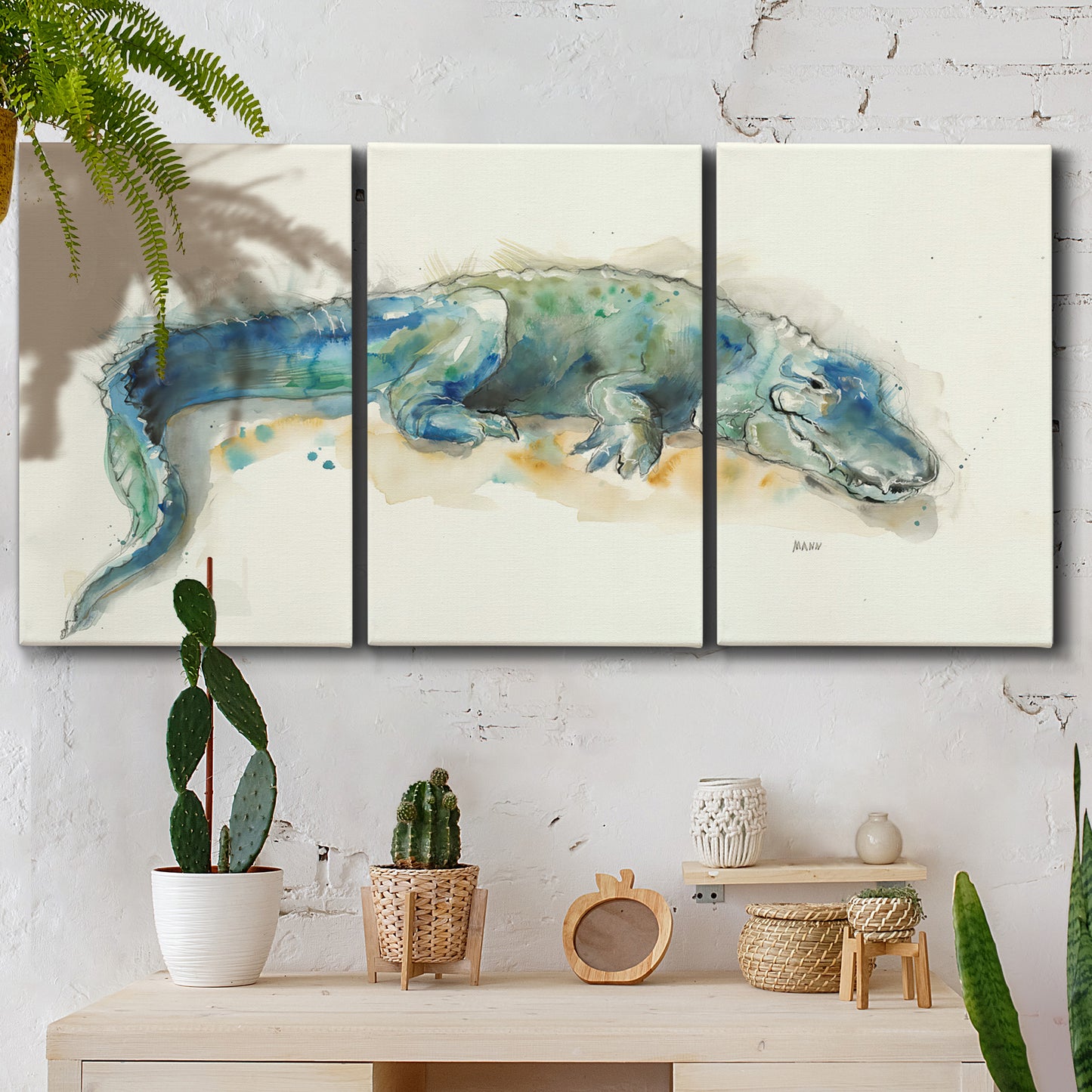Three-panel canvas wall art featuring alligator illustrated wildlife portrait, displayed in a boho-chic entryway above a console table.