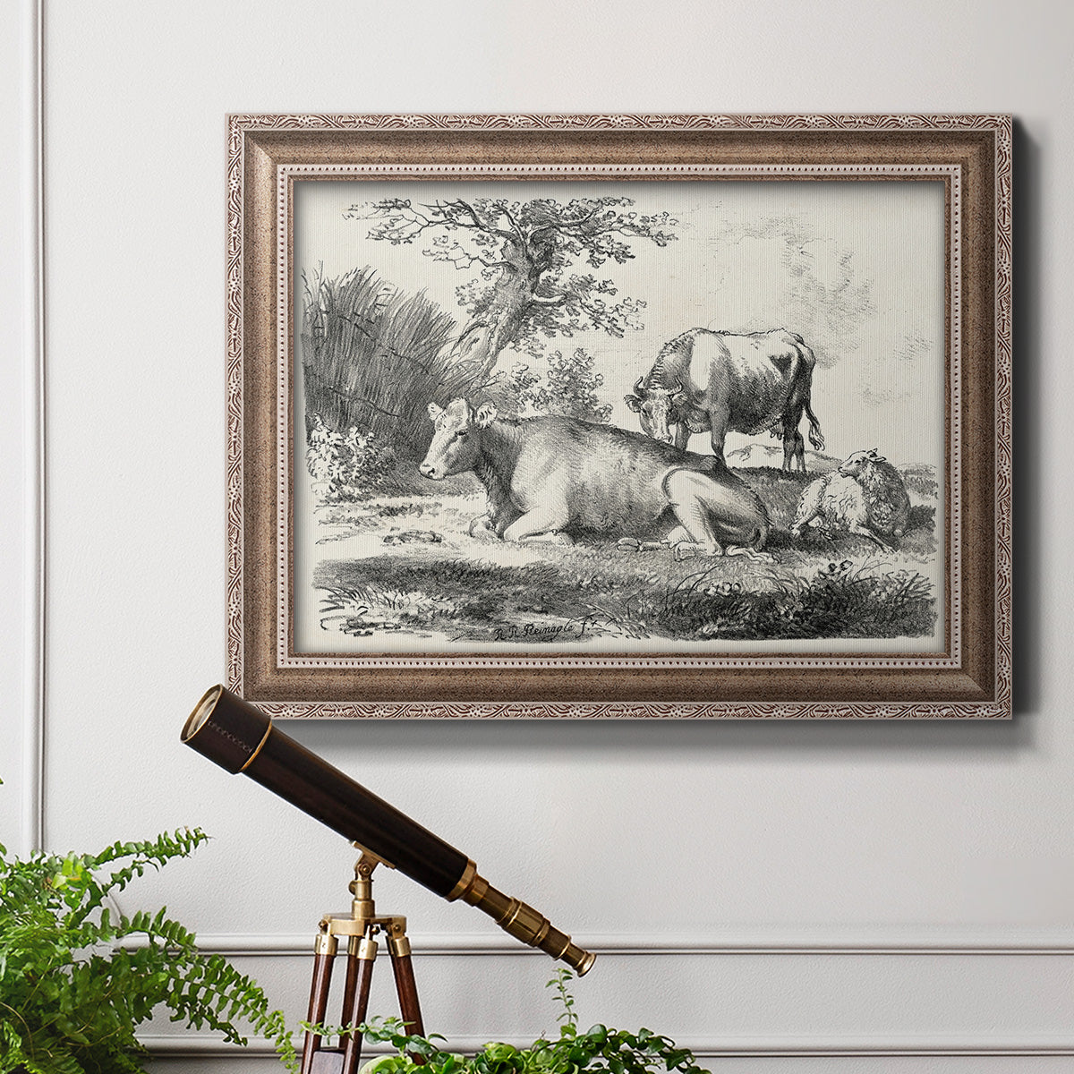 Classical pastoral landscape artwork by Nicolas Berchem in an ornate traditional silver frame displayed in a light-toned interior setting.