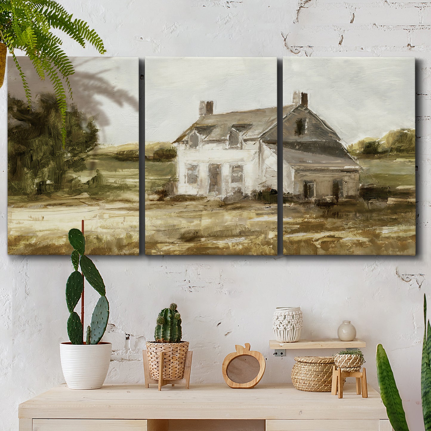 Three-panel canvas wall art featuring rural farmhouse harvest landscape, displayed in a boho-chic entryway above a console table.