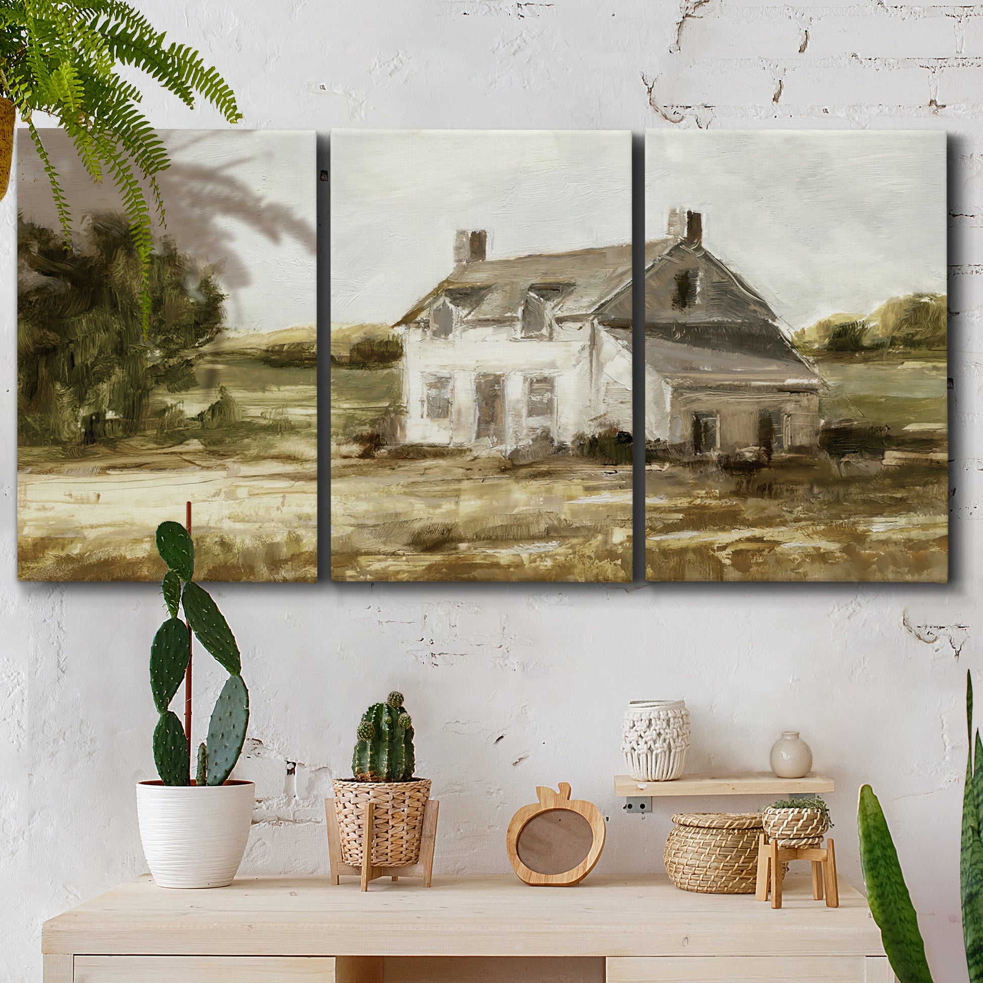 Three-panel canvas wall art featuring rural farmhouse harvest landscape, displayed in a boho-chic entryway above a console table.