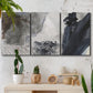 Three-panel canvas wall art featuring dark abstract atmospheric landscape, displayed in a boho-chic entryway above a console table.