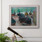 Impressionist coastal beach scene with boats by Claude Monet in an ornate weathered white frame displayed in a light-toned interior setting.