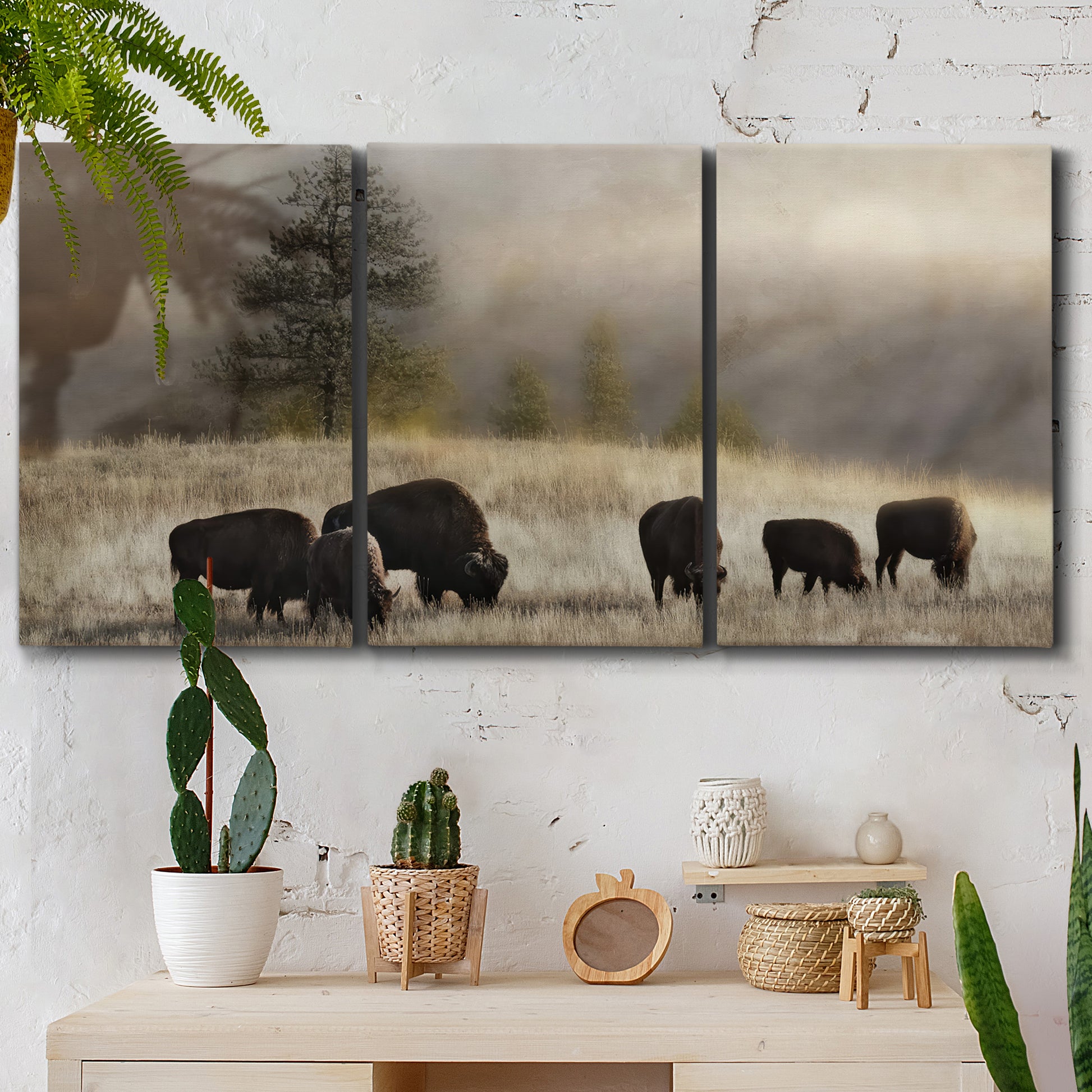 Three-panel canvas wall art featuring cattle grazing along ridge line, displayed in a boho-chic entryway above a console table.