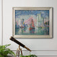 Impressionist harbor scene by Paul Signac in an ornate champagne frame displayed in a light-toned interior setting.