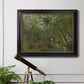 Traditional rural landscape scene with figures by Jean-Baptiste-Camille Corot in an ornate black frame with gilded inner detail displayed in a light-toned interior setting.