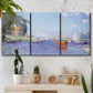 Three-panel canvas wall art featuring river flowing past riverside town, displayed in a boho-chic entryway above a console table.