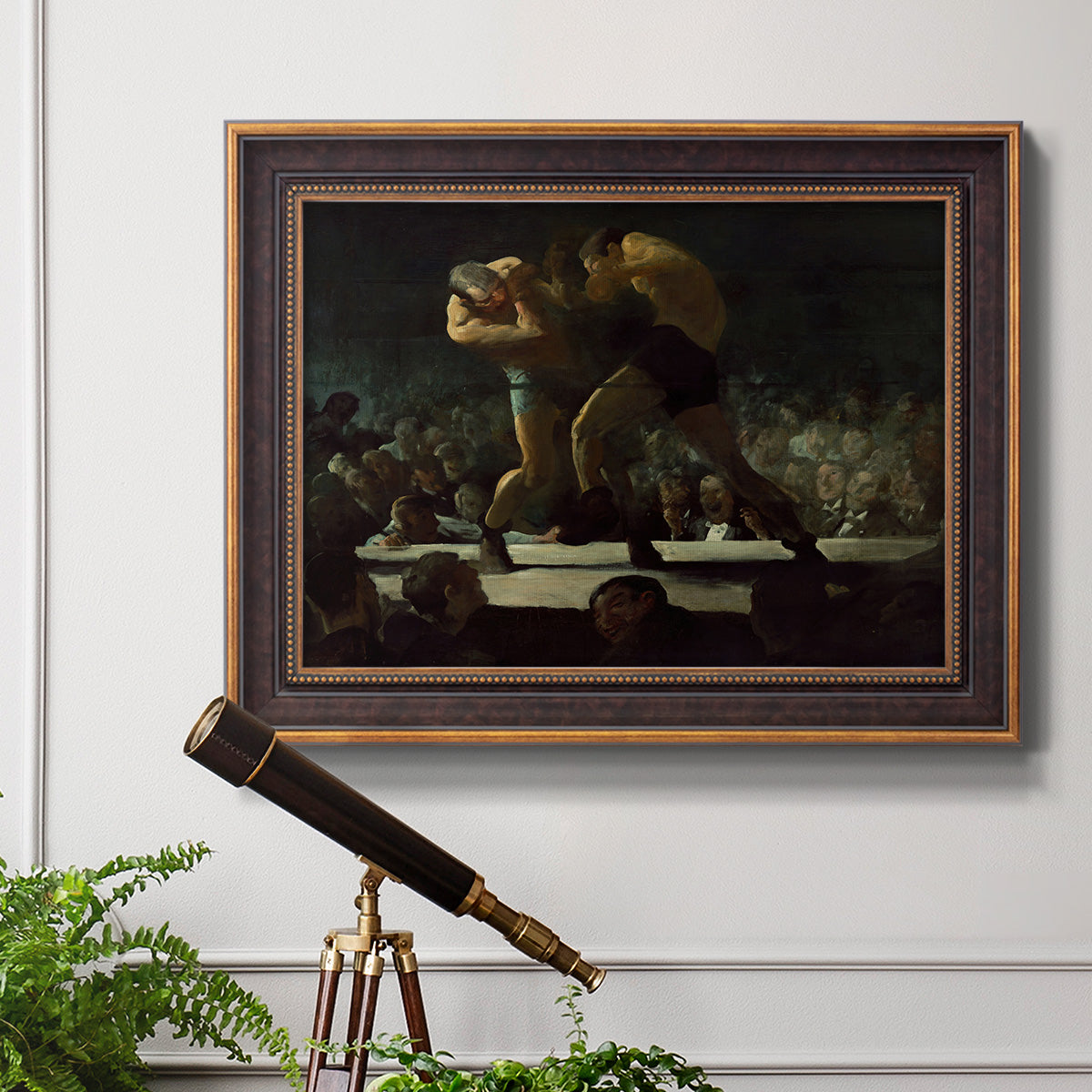 American social club scene painting by George Bellows in an ornate bronzed mahogany wood frame displayed in a light-toned interior setting.