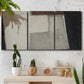 Three-panel canvas wall art featuring geometric abstract roadway motif, displayed in a boho-chic entryway above a console table.