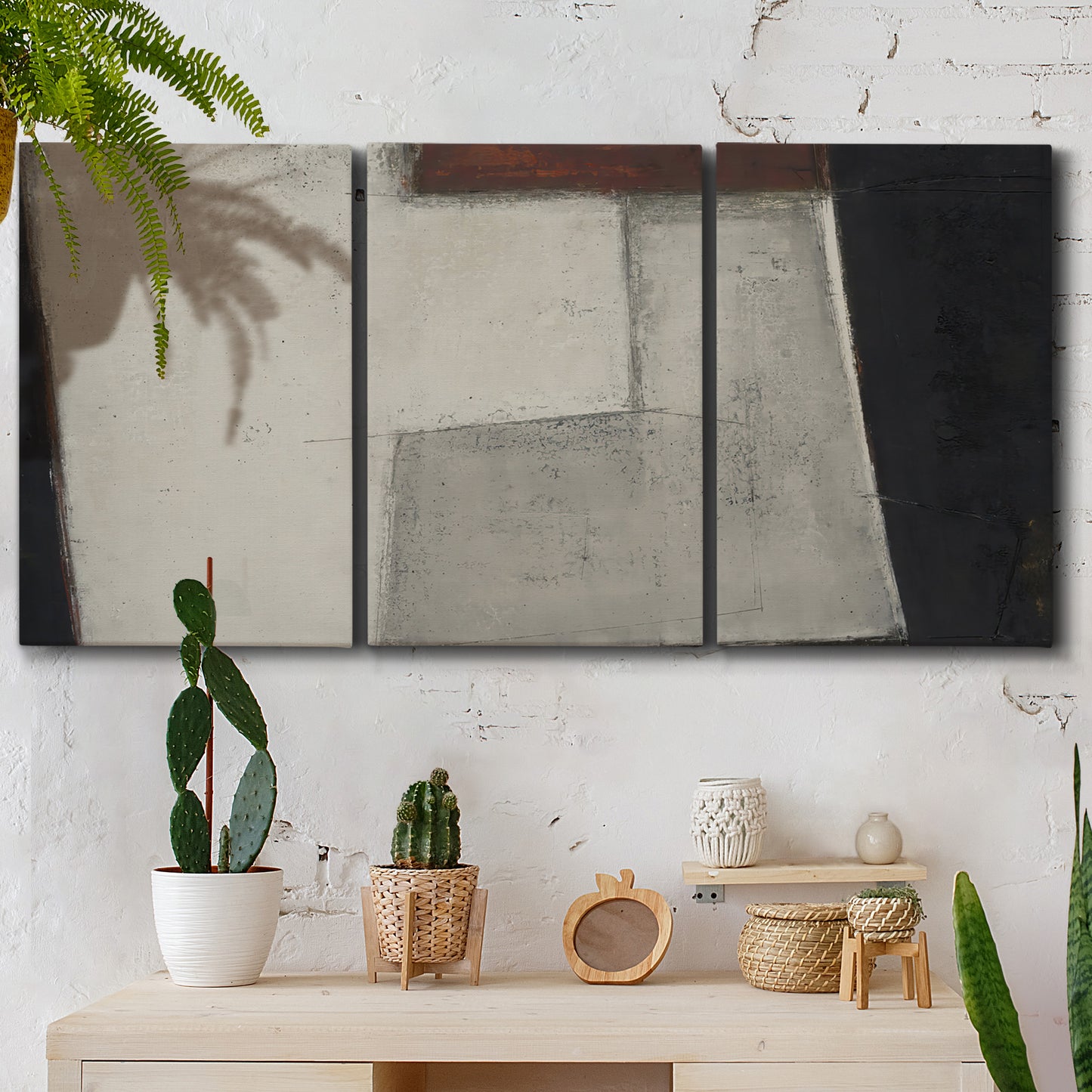 Three-panel canvas wall art featuring geometric abstract roadway motif, displayed in a boho-chic entryway above a console table.