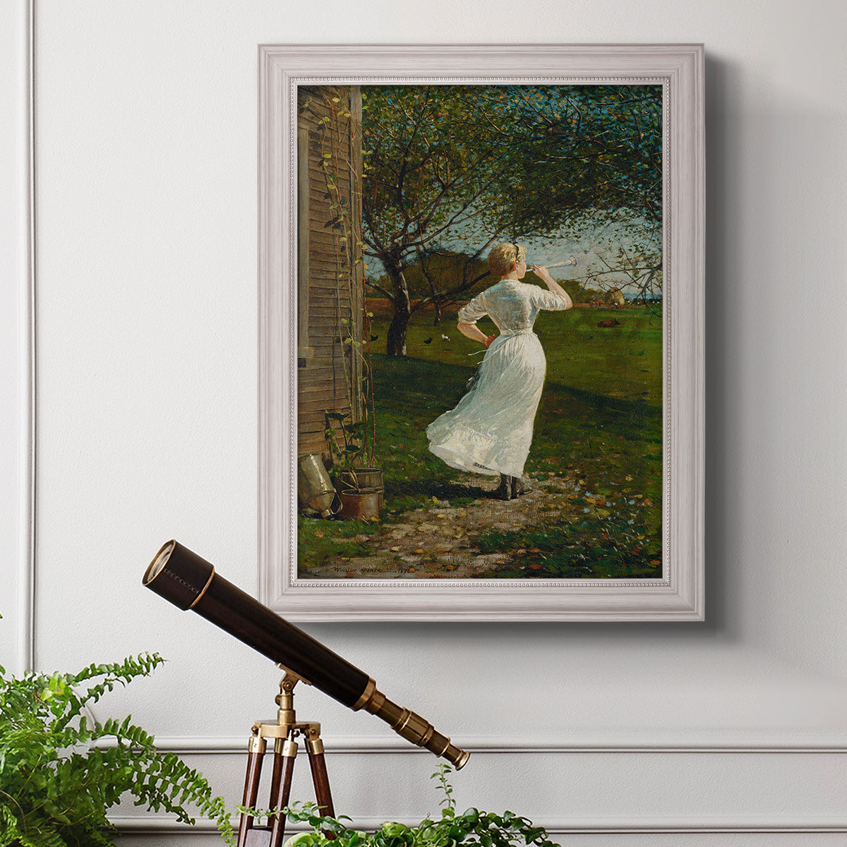 Narrative religious genre scene by Winslow Homer in an ornate weathered white frame displayed in a light-toned interior setting.