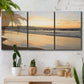 Three-panel canvas wall art featuring quiet tropical shoreline at low tide, displayed in a boho-chic entryway above a console table.