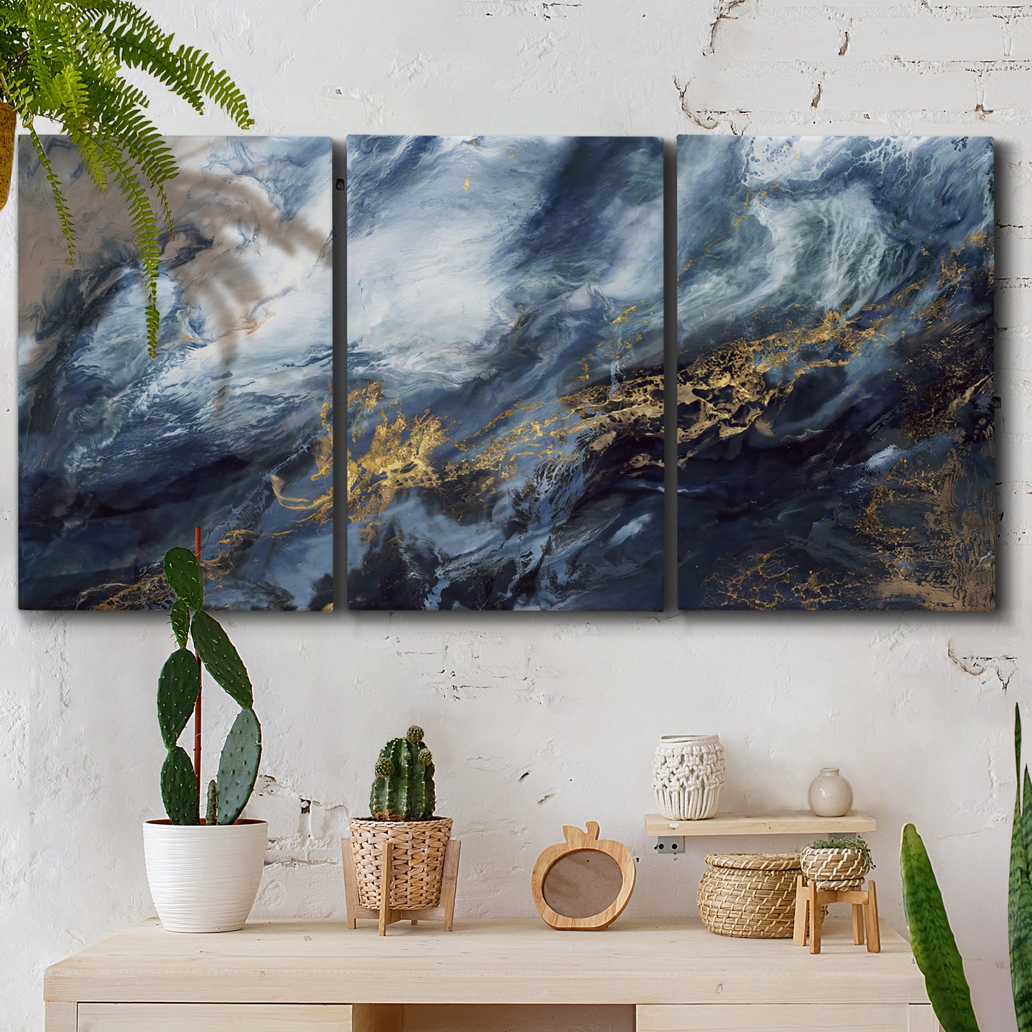 Three-panel canvas wall art featuring soft abstract landscape anticipation tones, displayed in a boho-chic entryway above a console table.