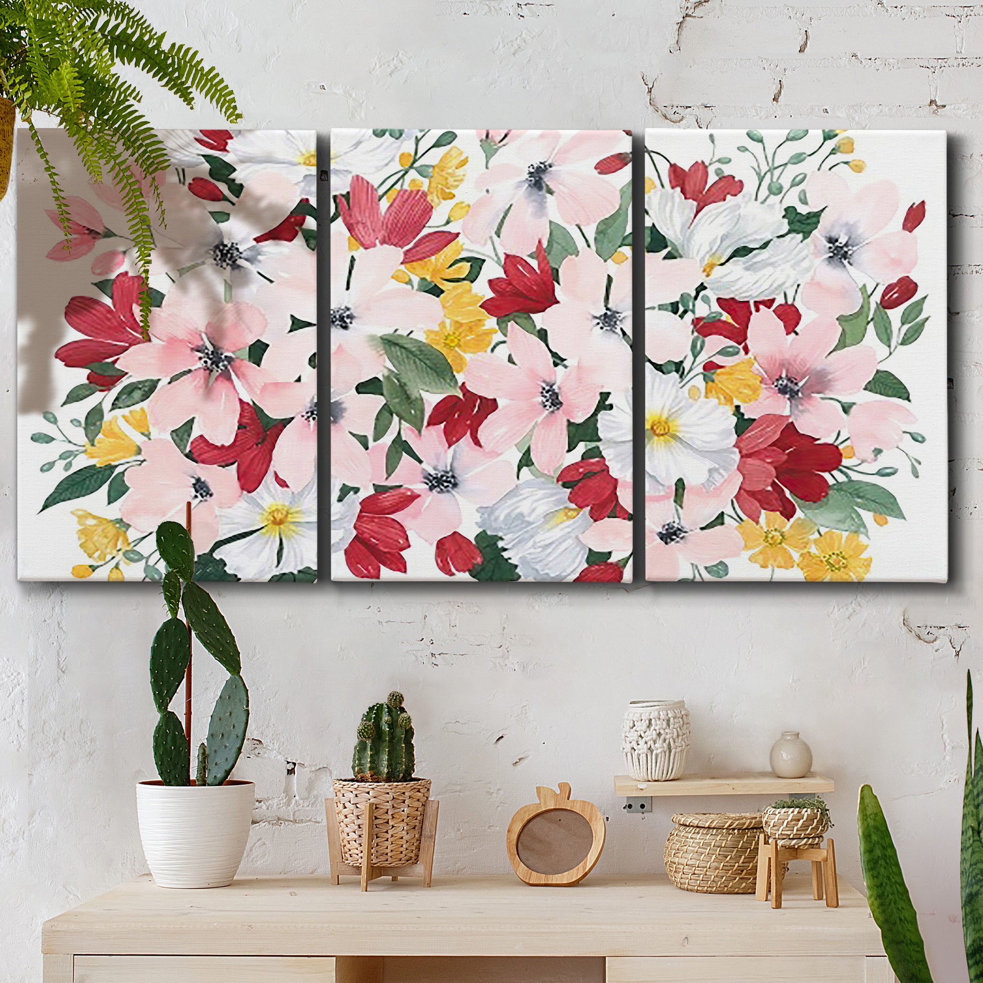Three-panel canvas wall art featuring joyful spring floral composition, displayed in a boho-chic entryway above a console table.