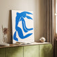Canvas art print of a stylized figure with simplified lines and vivid color blocks styled in a home decor setting.