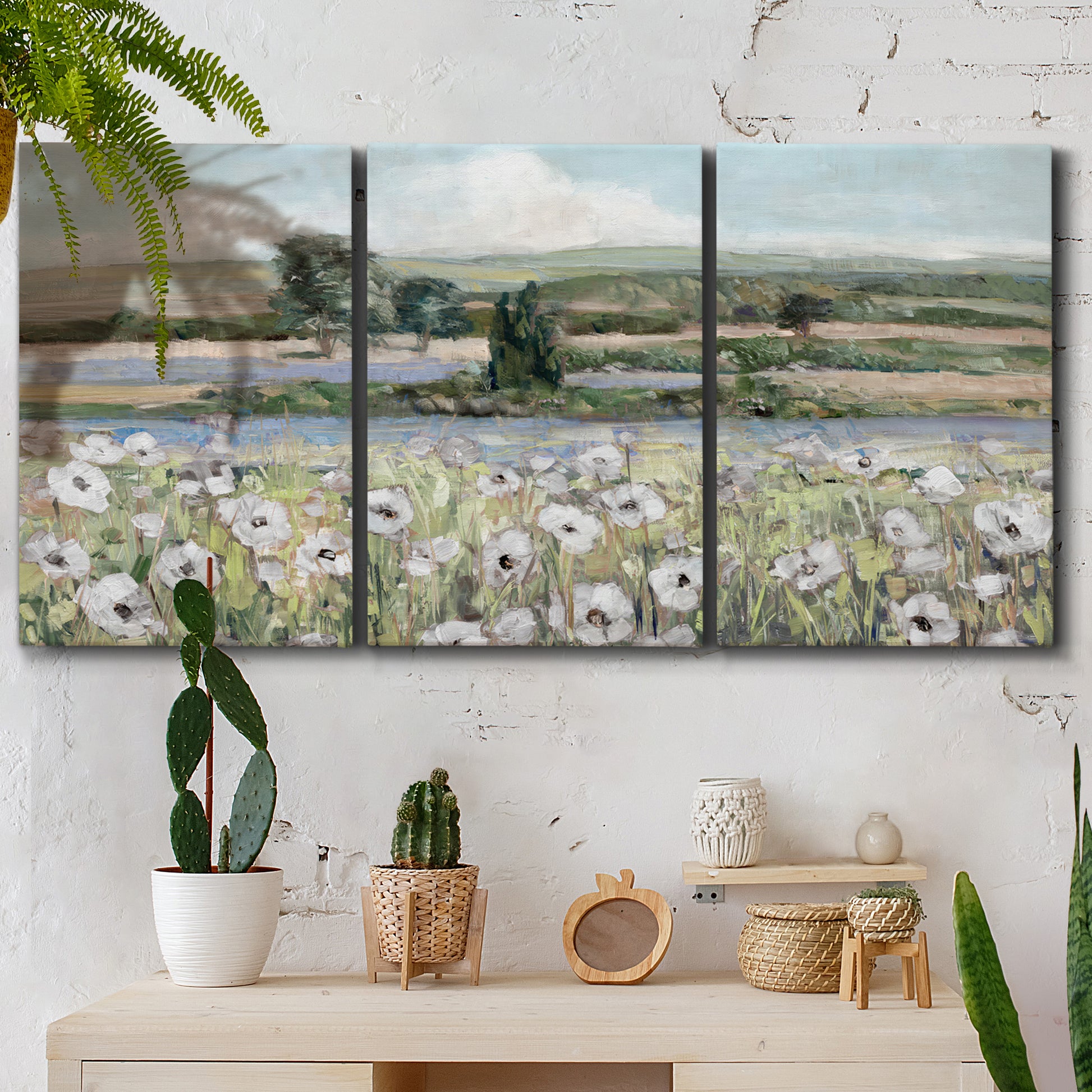 Three-panel canvas wall art featuring vintage poppy filled valley, displayed in a boho-chic entryway above a console table.