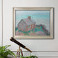 Impressionist coastal building landscape by Claude Monet in an ornate champagne frame displayed in a light-toned interior setting.