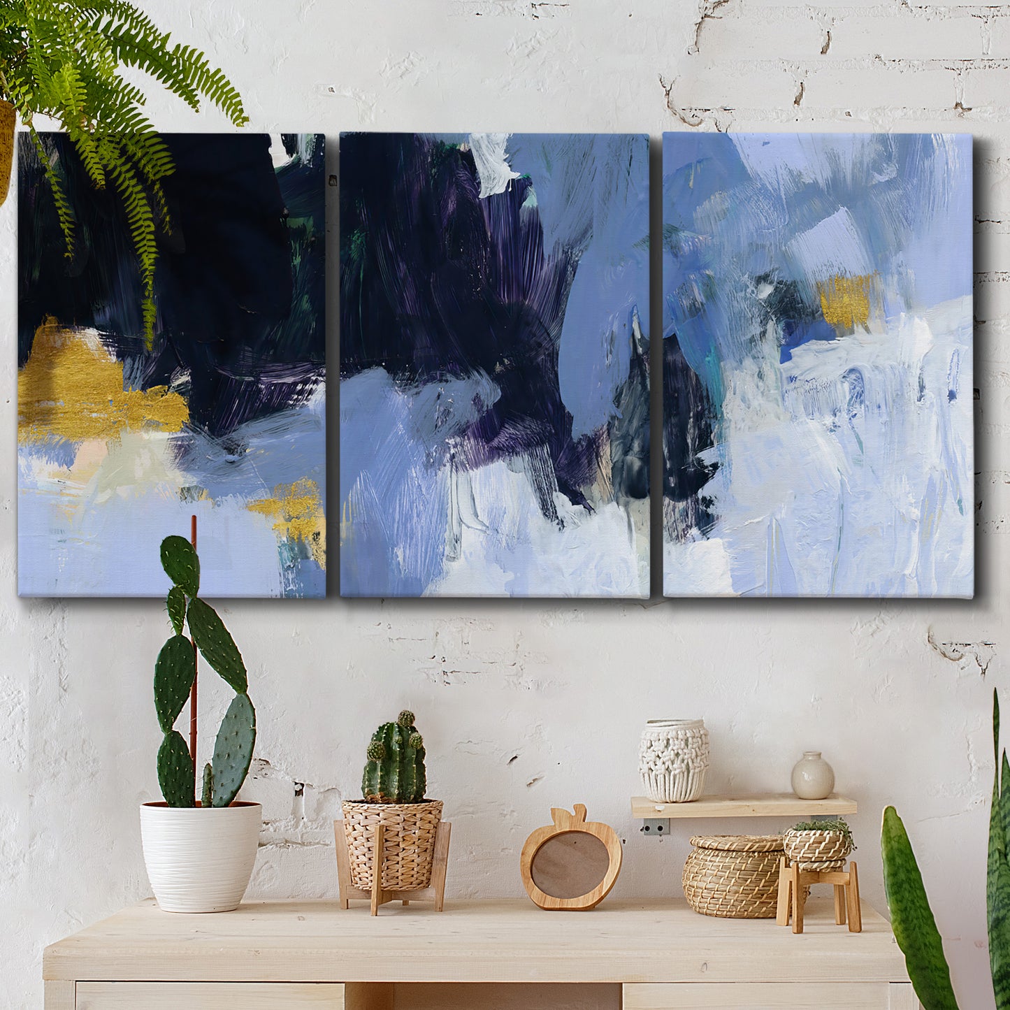 Three-panel canvas wall art featuring icy abstract arctic ledge, displayed in a boho-chic entryway above a console table.