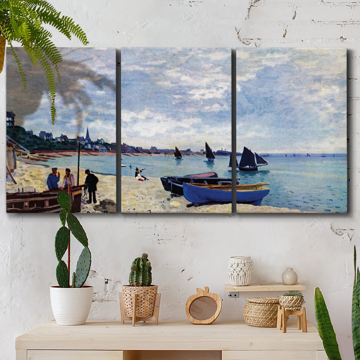 Three-panel canvas wall art featuring busy beach scene with shoreline, displayed in a boho-chic entryway above a console table.
