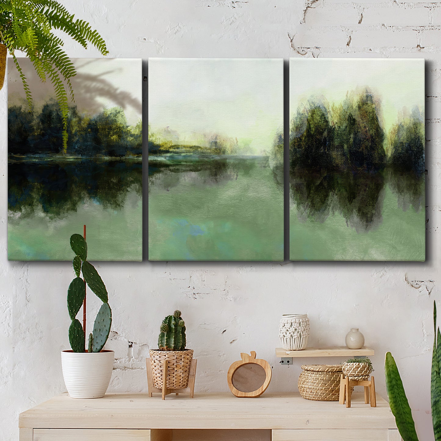 Three-panel canvas wall art featuring rain soaked landscape at sunset, displayed in a boho-chic entryway above a console table.