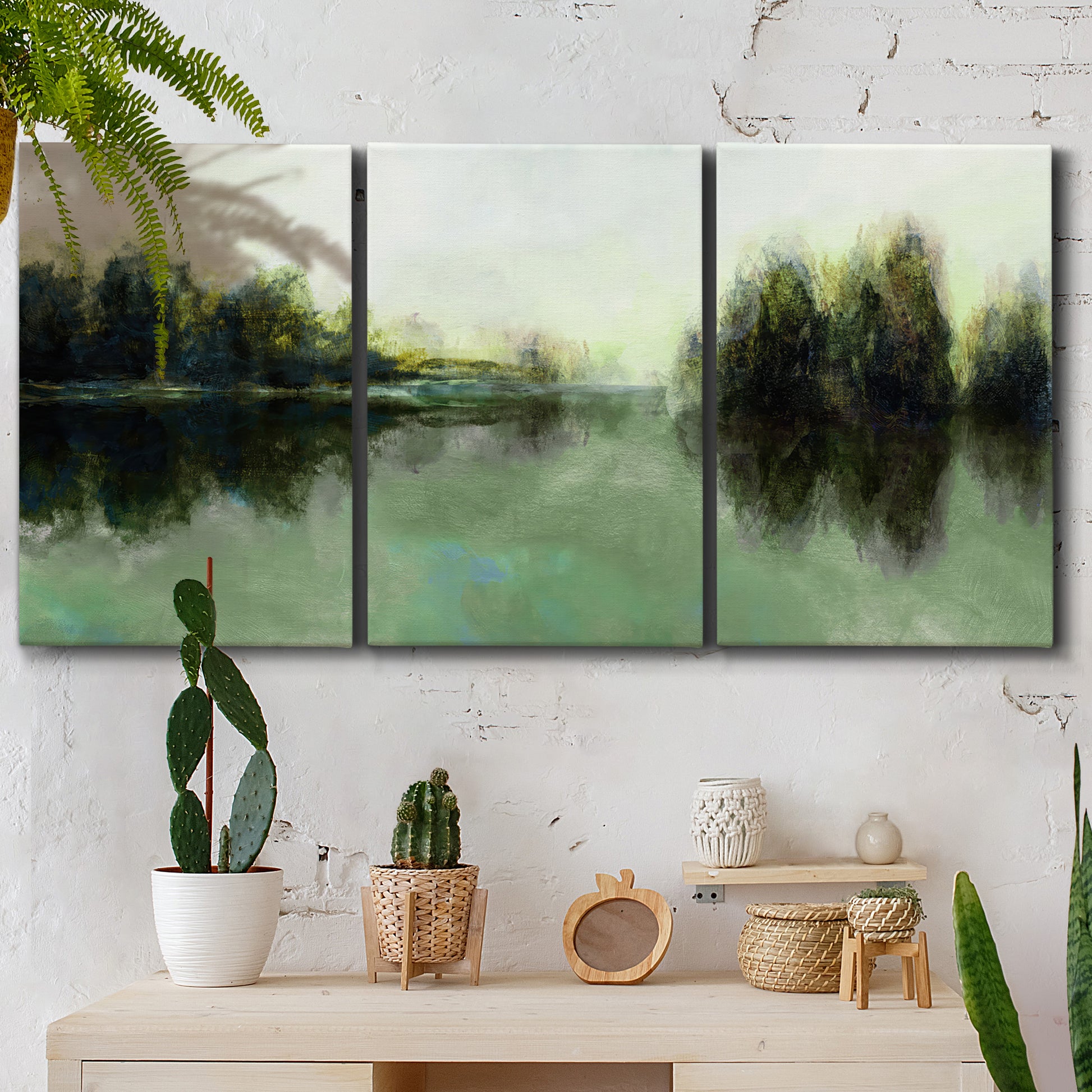 Three-panel canvas wall art featuring rain soaked landscape at sunset, displayed in a boho-chic entryway above a console table.