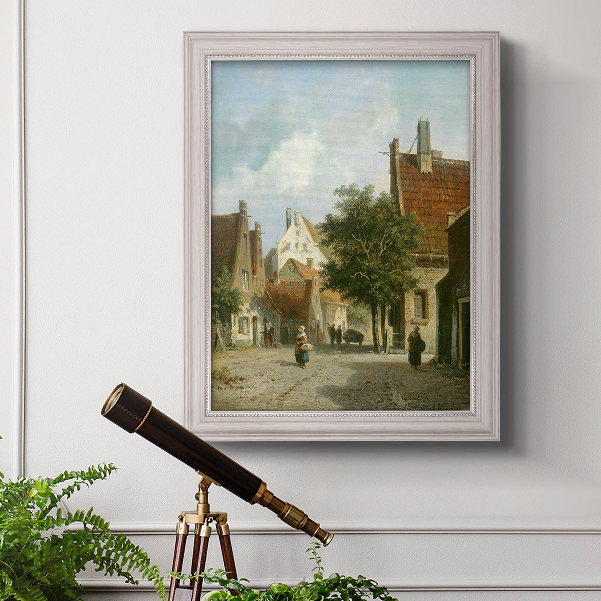 Rustic European street scene painting by Adriaan Eversen in an ornate weathered white frame displayed in a light-toned interior setting.