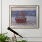 Impressionist single haystack landscape by Claude Monet in an ornate champagne frame displayed in a light-toned interior setting.