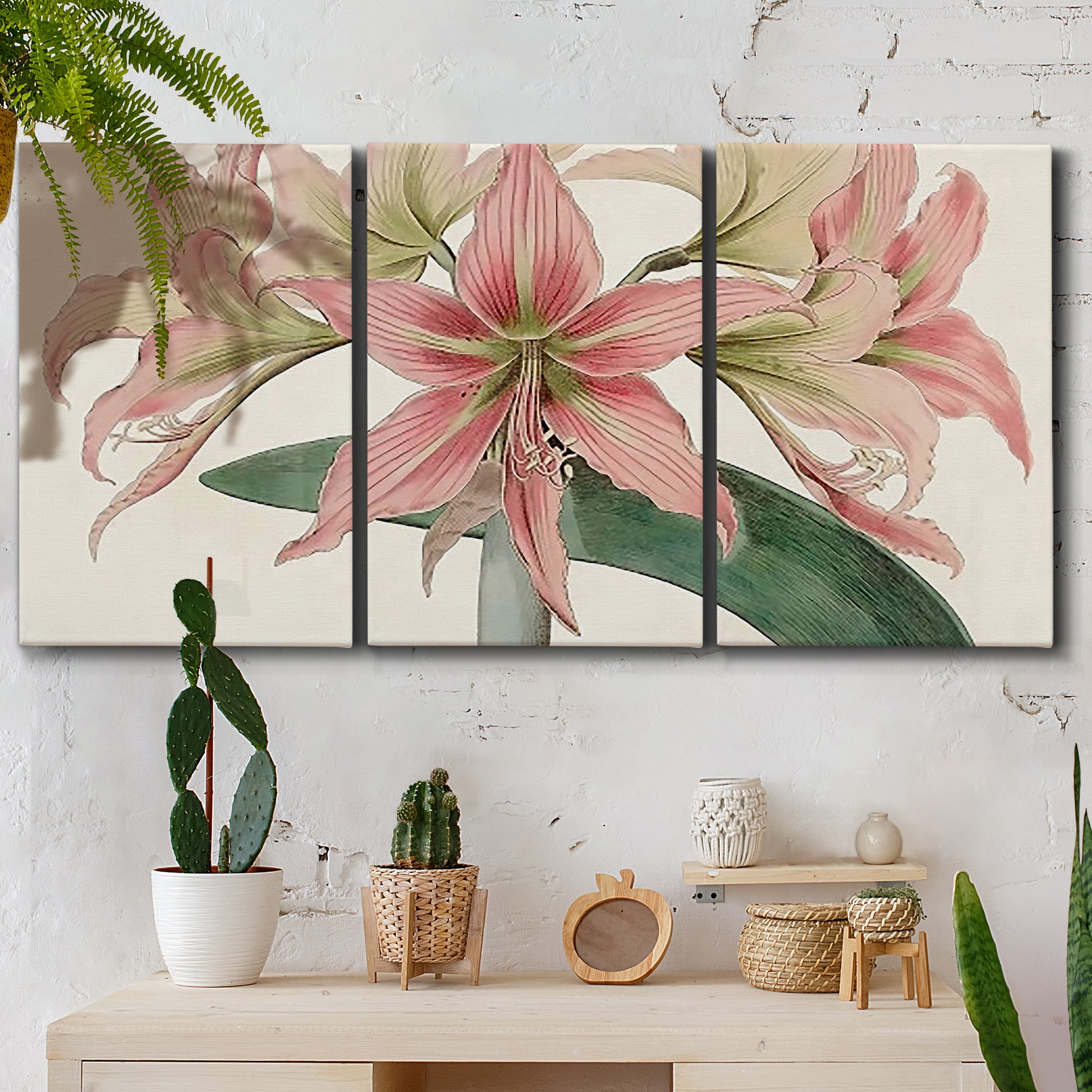 Three-panel canvas wall art featuring vintage styled amaryllis floral study, displayed in a boho-chic entryway above a console table.