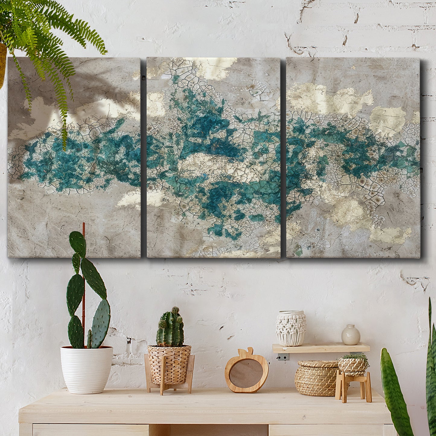 Three-panel canvas wall art featuring layered mineral abstract textures, displayed in a boho-chic entryway above a console table.