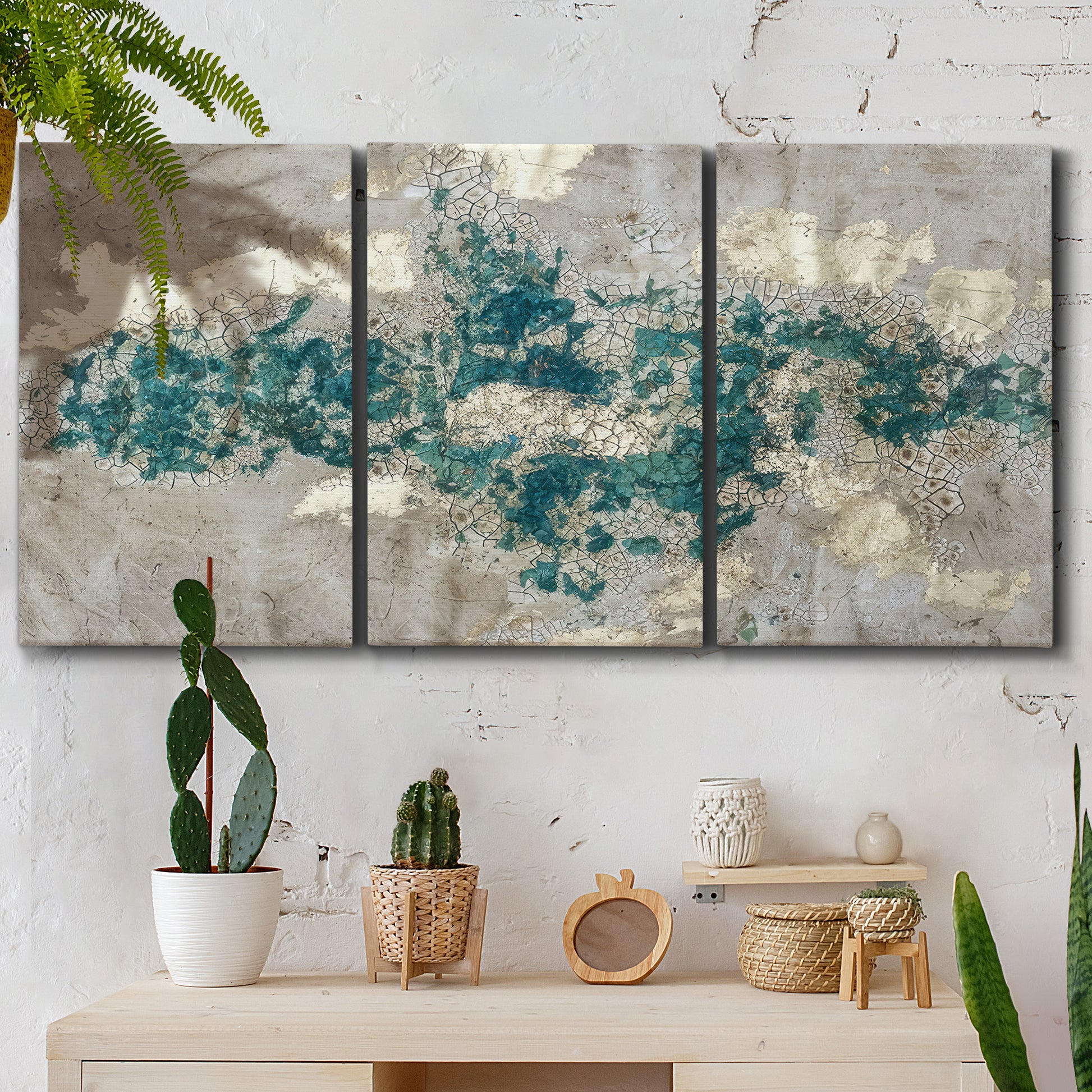 Three-panel canvas wall art featuring layered mineral abstract textures, displayed in a boho-chic entryway above a console table.