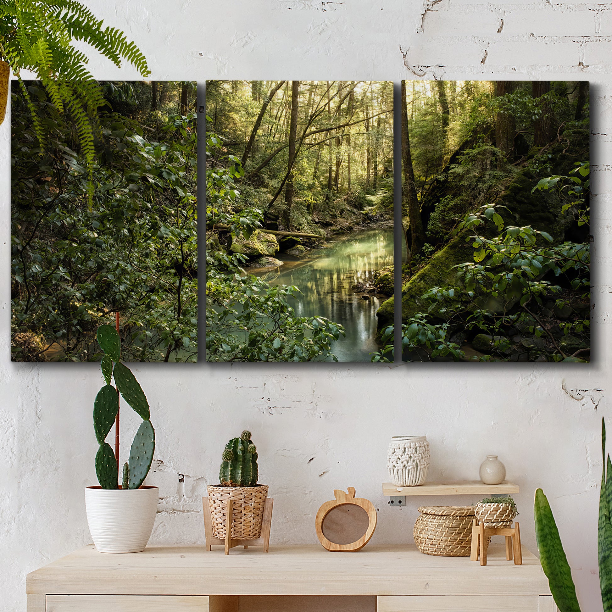 Three-panel canvas wall art featuring sun filtered woodland photograph, displayed in a boho-chic entryway above a console table.