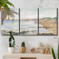 Three-panel canvas wall art featuring coastal shoreline landscape study, displayed in a boho-chic entryway above a console table.