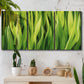 Three-panel canvas wall art featuring close view of tall green grass blades, displayed in a boho-chic entryway above a console table.