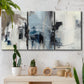 Three-panel canvas wall art featuring cool abstract winter color wash, displayed in a boho-chic entryway above a console table.
