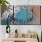 Three-panel canvas wall art featuring playful abstract mark making, displayed in a boho-chic entryway above a console table.