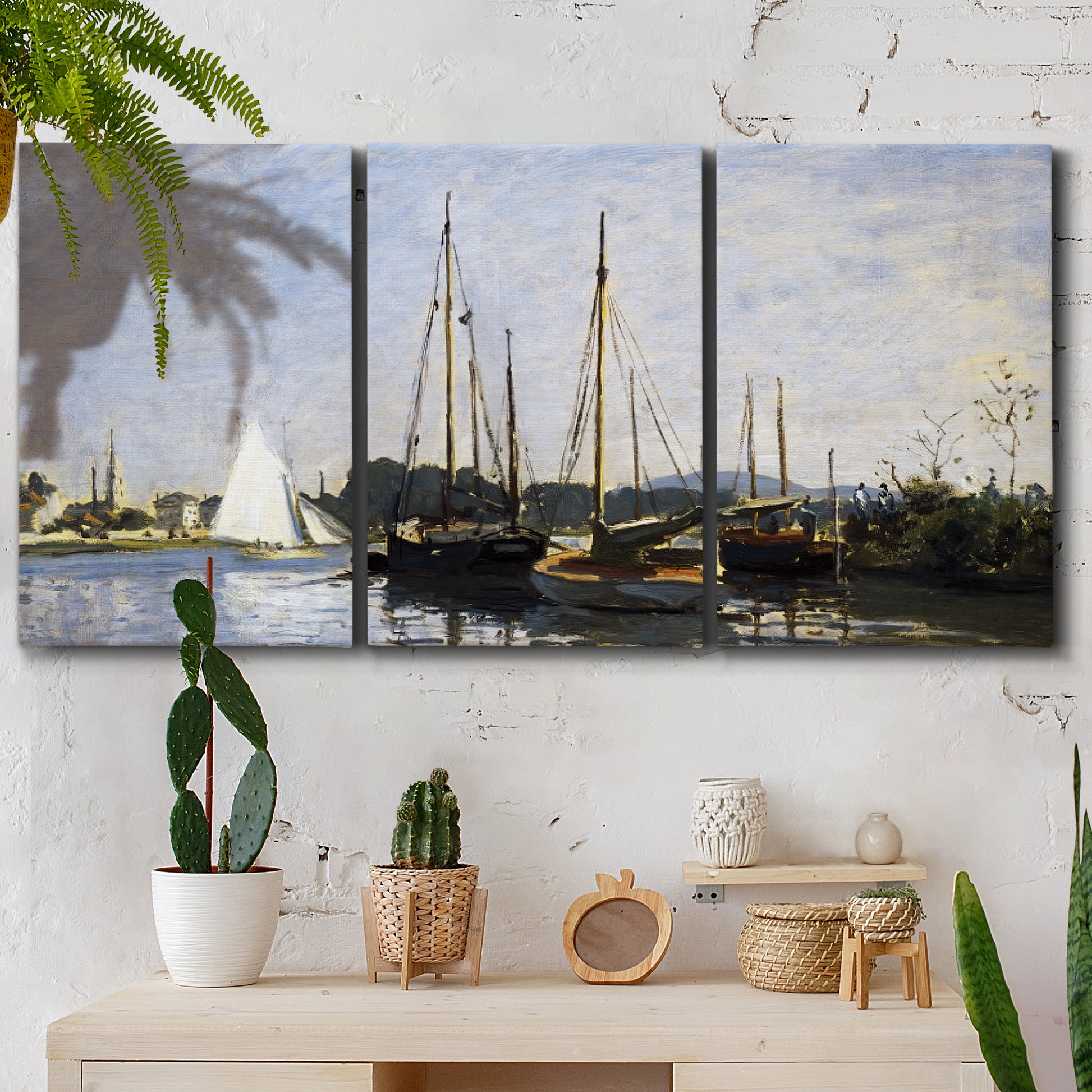 Three-panel canvas wall art featuring small pleasure boats on calm water, displayed in a boho-chic entryway above a console table.