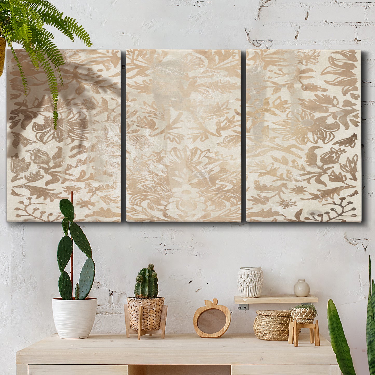 Three-panel canvas wall art featuring ornamental damask abstract pattern, displayed in a boho-chic entryway above a console table.