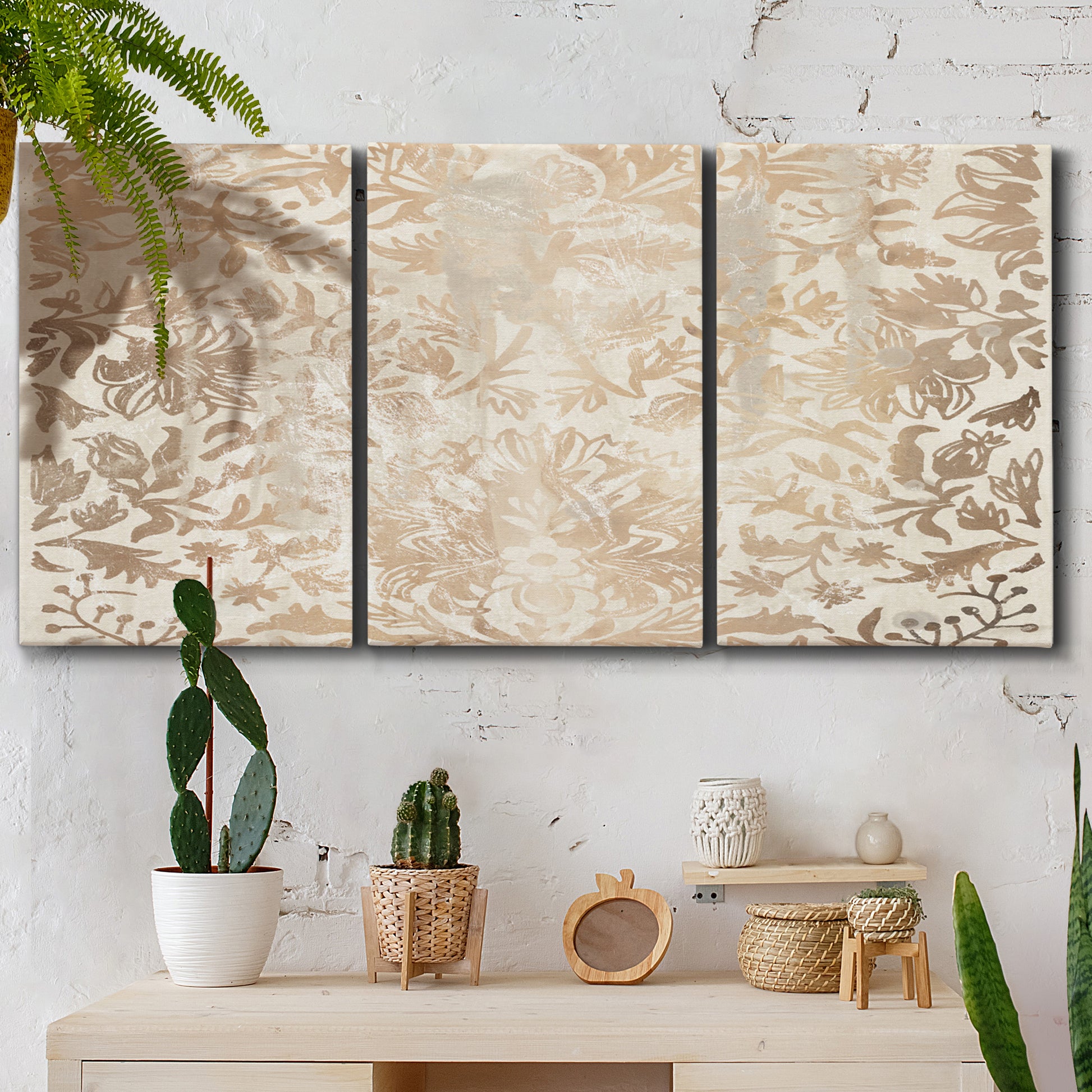 Three-panel canvas wall art featuring ornamental damask abstract pattern, displayed in a boho-chic entryway above a console table.
