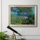 Impressionist Mediterranean coastal landscape by Claude Monet in an ornate champagne frame displayed in a light-toned interior setting.