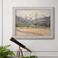 Impressionist valley landscape in southern France by Claude Monet in an ornate weathered white frame displayed in a light-toned interior setting.