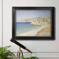 Impressionist Mediterranean jetty seascape by Paul Signac in an ornate black frame with gilded inner detail displayed in a light-toned interior setting.