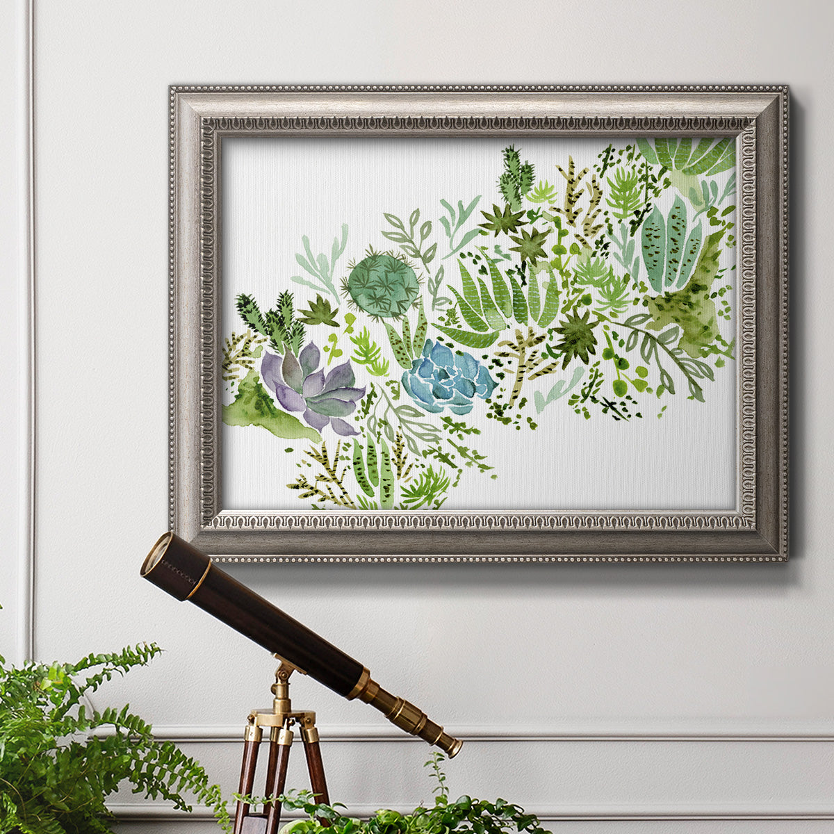Minimalist abstract succulent botanical watercolor artwork in an ornate vintage silver frame displayed in a light-toned interior setting.
